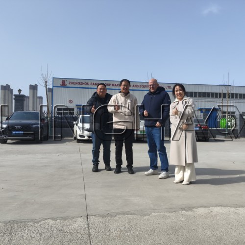 Moroccan procurement specialist reviewing custom concrete batching plant design at SanqGroup engineering office